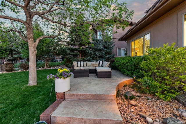 6874 Raspberry Run, Littleton, CO 80125 - view of green lawn featuring an outdoor living space and a patio area