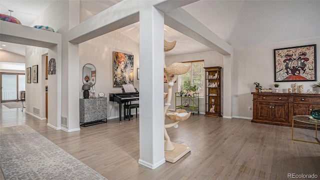 22778 E Alamo Ln, Aurora, CO 80015 - entrance foyer with wood finished floors, lofted ceiling, and arched walkways