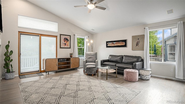 22778 E Alamo Ln, Aurora, CO 80015 - living room featuring healthy amount of natural light, a ceiling fan, lofted ceiling, and wood finished floors