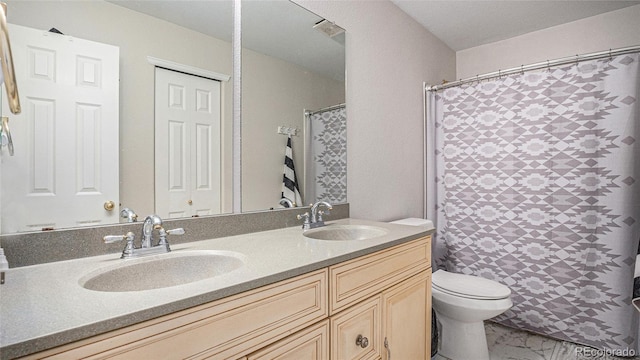 22778 E Alamo Ln, Aurora, CO 80015 - bathroom with double vanity, marble look tiles, and a shower with curtain