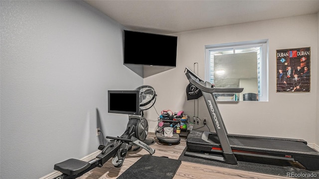 22778 E Alamo Ln, Aurora, CO 80015 - exercise area featuring wood finished floors and baseboards