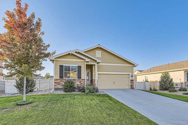 view of front of home featuring a garage and a front yard