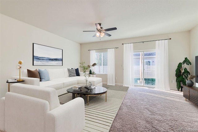 living room with carpet floors and ceiling fan