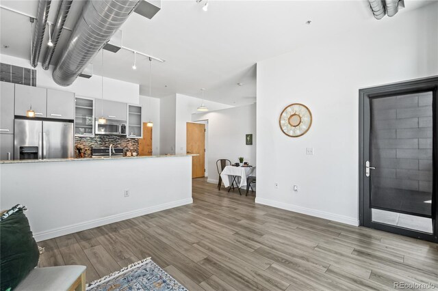 3100 Huron St Unit 1A, Denver, CO 80202 - living room with light wood-type flooring and baseboards