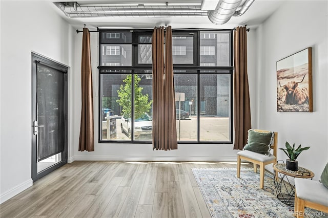 3100 Huron St Unit 1A, Denver, CO 80202 - sitting room with wood finished floors and baseboards