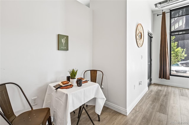 3100 Huron St Unit 1A, Denver, CO 80202 - dining area featuring light wood-type flooring and baseboards