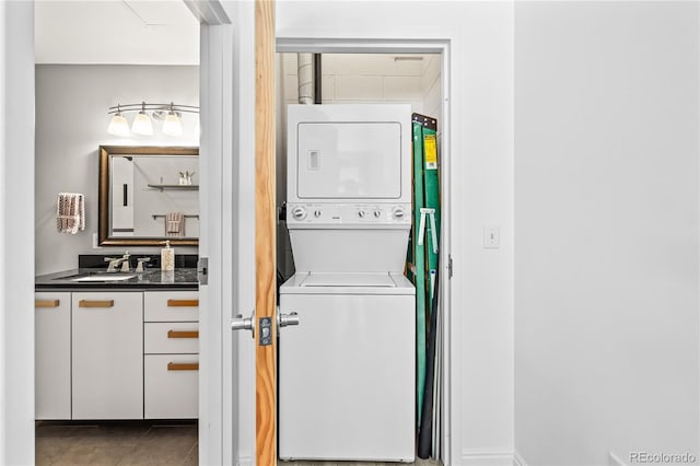 3100 Huron St Unit 1A, Denver, CO 80202 - washroom with stacked washer / dryer and tile patterned flooring