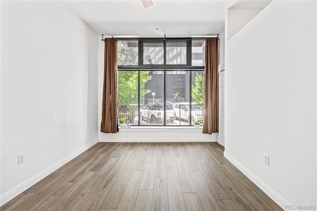 3100 Huron St Unit 1A, Denver, CO 80202 - spare room with wood finished floors and baseboards