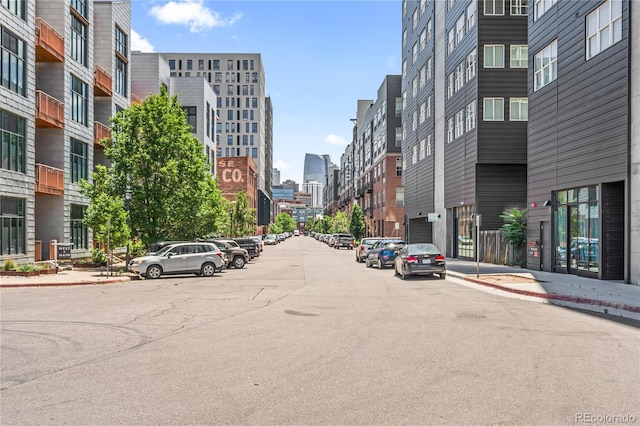 3100 Huron St Unit 1A, Denver, CO 80202 - view of asphalt street featuring a city view, sidewalks, and curbs