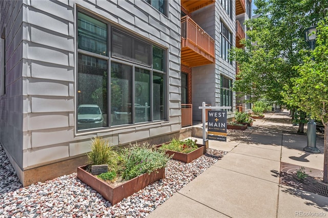 3100 Huron St Unit 1A, Denver, CO 80202 - view of property exterior with a garden and a balcony