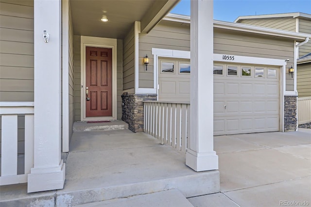 10555 Boston St, Commerce City, CO 80640 - property entrance featuring stone siding and concrete driveway
