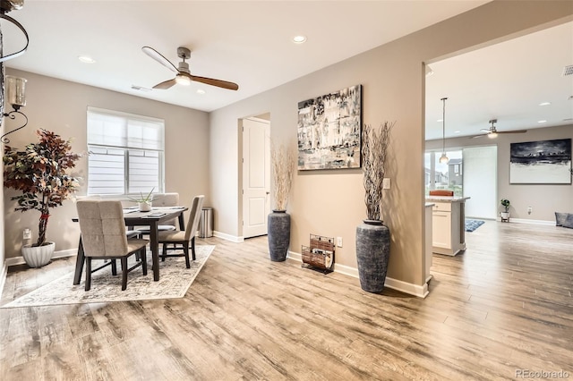 10555 Boston St, Commerce City, CO 80640 - dining space with a ceiling fan, light wood finished floors, healthy amount of natural light, baseboards, and recessed lighting