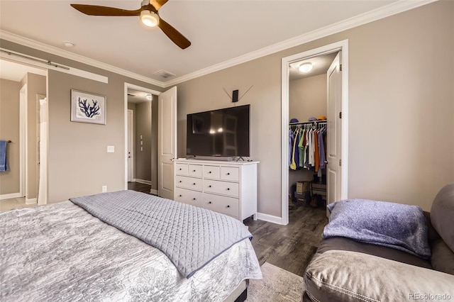 10555 Boston St, Commerce City, CO 80640 - bedroom featuring a spacious closet, wood finished floors, baseboards, ornamental molding, and a closet