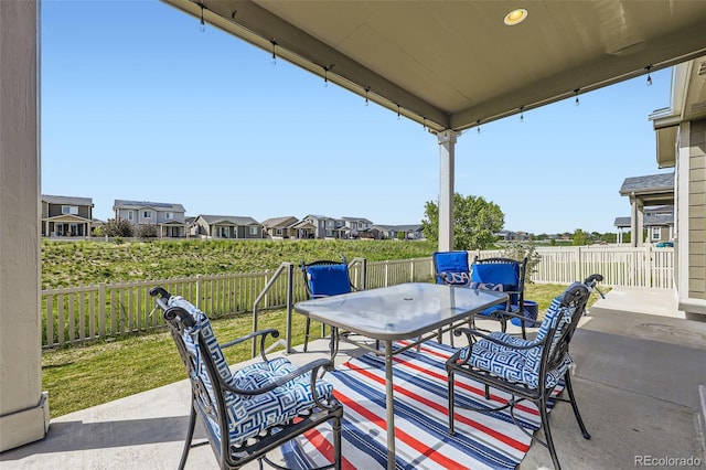 10555 Boston St, Commerce City, CO 80640 - fenced backyard featuring outdoor dining space, a patio area, and a residential view