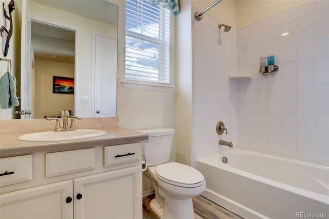 full bathroom with toilet, shower / washtub combination, wood finished floors, and vanity