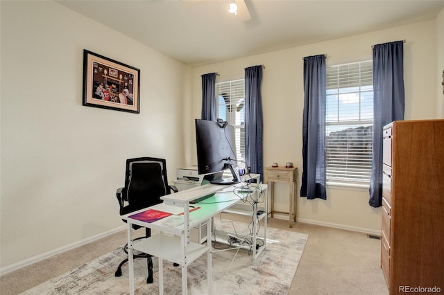 home office with light carpet and baseboards