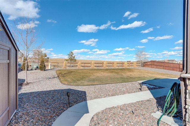 view of yard with a fenced backyard and a patio