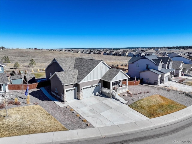 birds eye view of property with a residential view