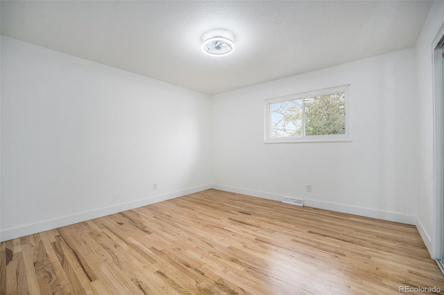 11172 W Exposition Dr, Denver, CO 80226 - empty room featuring wood finished floors and baseboards