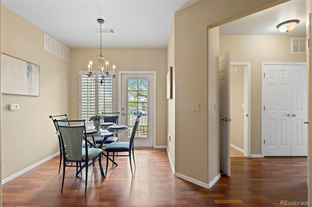 2662 S Cathay Way Unit 112, Aurora, CO 80013 - dining space with a chandelier, wood finished floors, and baseboards