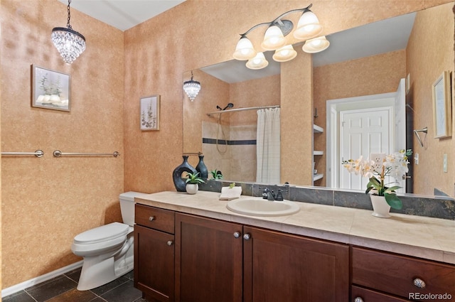 2662 S Cathay Way Unit 112, Aurora, CO 80013 - full bath featuring toilet, tile patterned flooring, a chandelier, a tile shower, and vanity