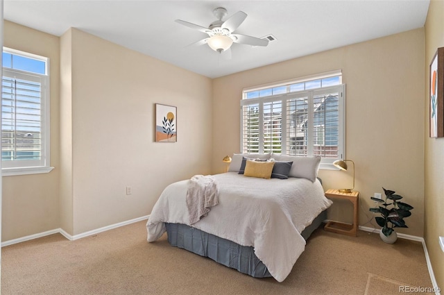 2662 S Cathay Way Unit 112, Aurora, CO 80013 - bedroom featuring multiple windows, baseboards, and carpet floors