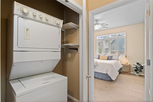 2662 S Cathay Way Unit 112, Aurora, CO 80013 - laundry room featuring stacked washer / drying machine, carpet flooring, baseboards, and a ceiling fan