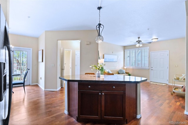 2662 S Cathay Way Unit 112, Aurora, CO 80013 - kitchen featuring dark brown cabinets, wood finished floors, hanging light fixtures, refrigerator with ice dispenser, and a ceiling fan