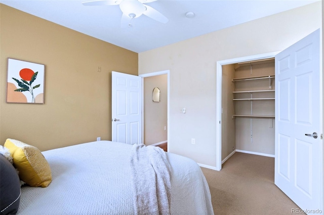 2662 S Cathay Way Unit 112, Aurora, CO 80013 - carpeted bedroom with a spacious closet, baseboards, a ceiling fan, and a closet