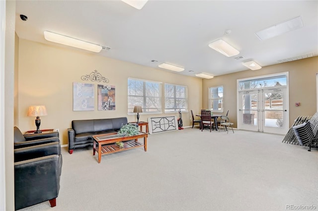 2662 S Cathay Way Unit 112, Aurora, CO 80013 - carpeted living room with french doors and baseboards