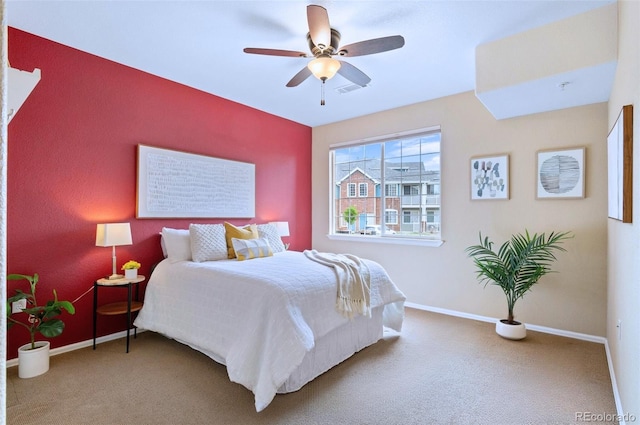 2662 S Cathay Way Unit 112, Aurora, CO 80013 - carpeted bedroom featuring baseboards and a ceiling fan