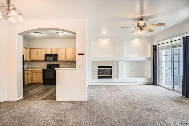12711 Colorado Blvd Unit 607F, Thornton, CO 80241 - kitchen with black appliances, dark colored carpet, light brown cabinetry, a ceiling fan, and open floor plan