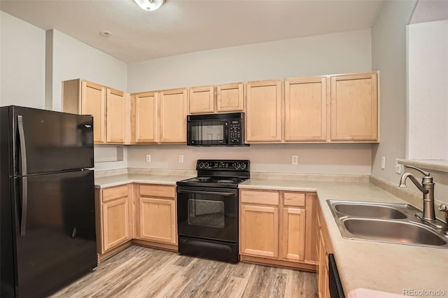 12711 Colorado Blvd Unit 607F, Thornton, CO 80241 - kitchen with black appliances, light brown cabinetry, light wood finished floors, and light countertops