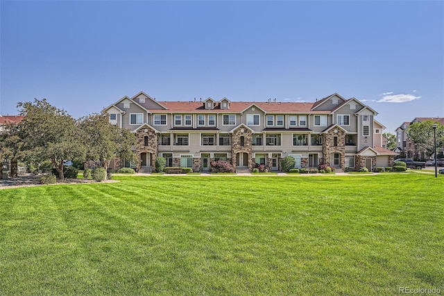 12711 Colorado Blvd Unit 607F, Thornton, CO 80241 - townhome / multi-family property with stone siding and a front yard