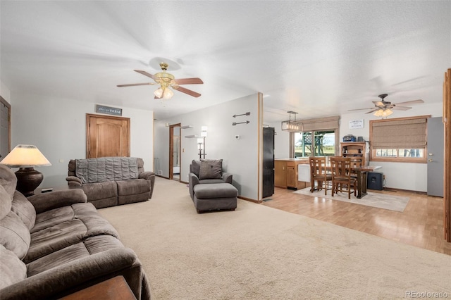 35055 E Mississippi Ave, Watkins, CO 80137 - living area with light carpet, baseboards, and a ceiling fan