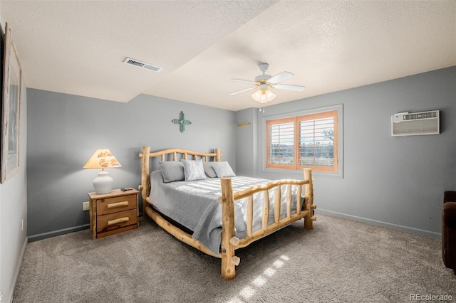 35055 E Mississippi Ave, Watkins, CO 80137 - bedroom with a textured ceiling, an AC wall unit, baseboards, and visible vents