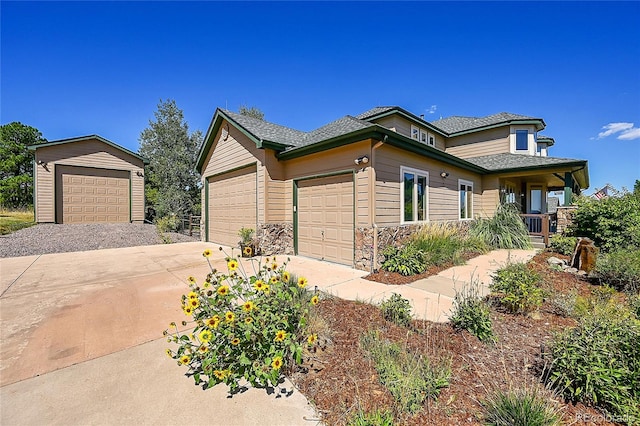 view of front of property with covered porch and a garage