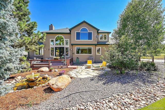 view of front of home featuring a patio area and a wooden deck