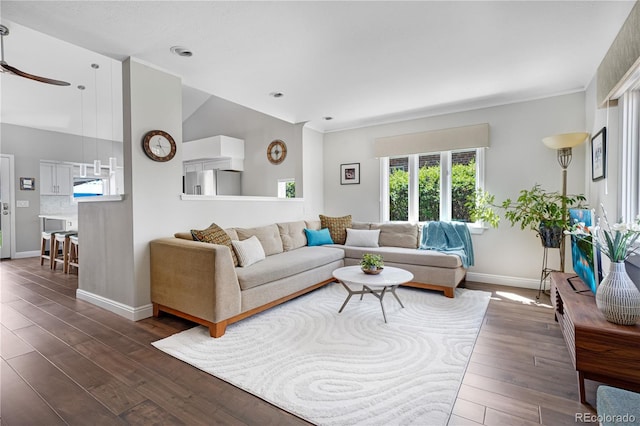 living area featuring dark wood-style floors, baseboards, a ceiling fan, and recessed lighting