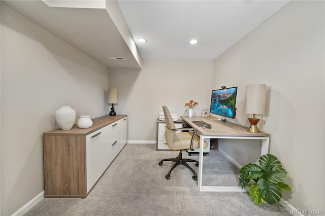 office space featuring light carpet, baseboards, and recessed lighting