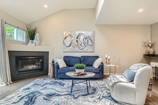 5150 Buckingham Rd, Boulder, CO 80301 - living area with wood finished floors, a glass covered fireplace, recessed lighting, and vaulted ceiling