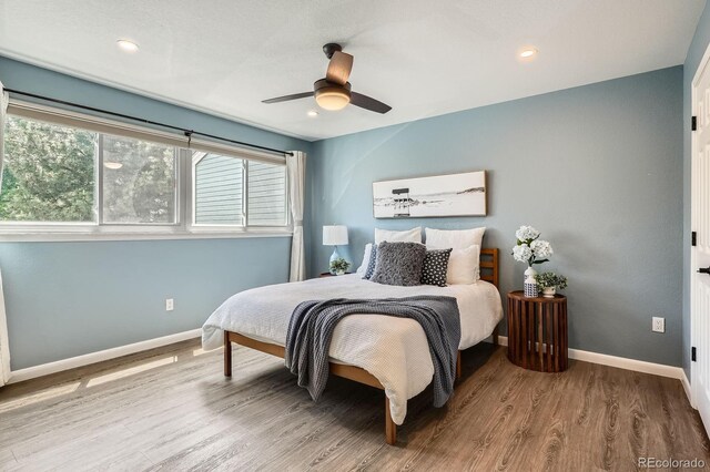 5150 Buckingham Rd, Boulder, CO 80301 - bedroom featuring wood finished floors, a ceiling fan, and recessed lighting