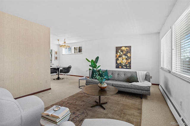 carpeted living room featuring a baseboard radiator and a healthy amount of sunlight