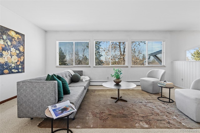 carpeted living room featuring a baseboard radiator