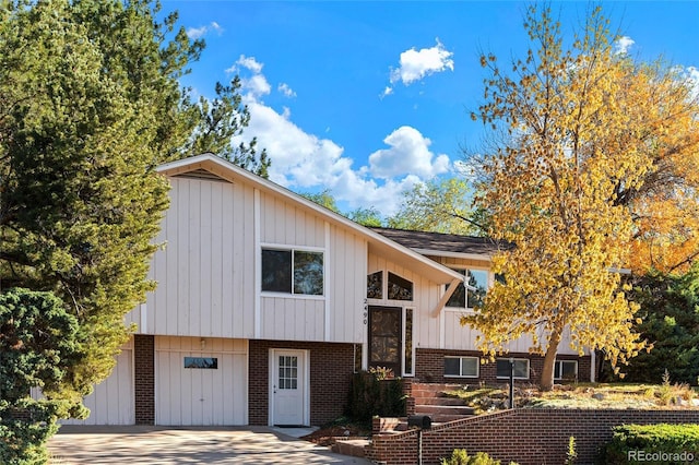 raised ranch featuring a garage