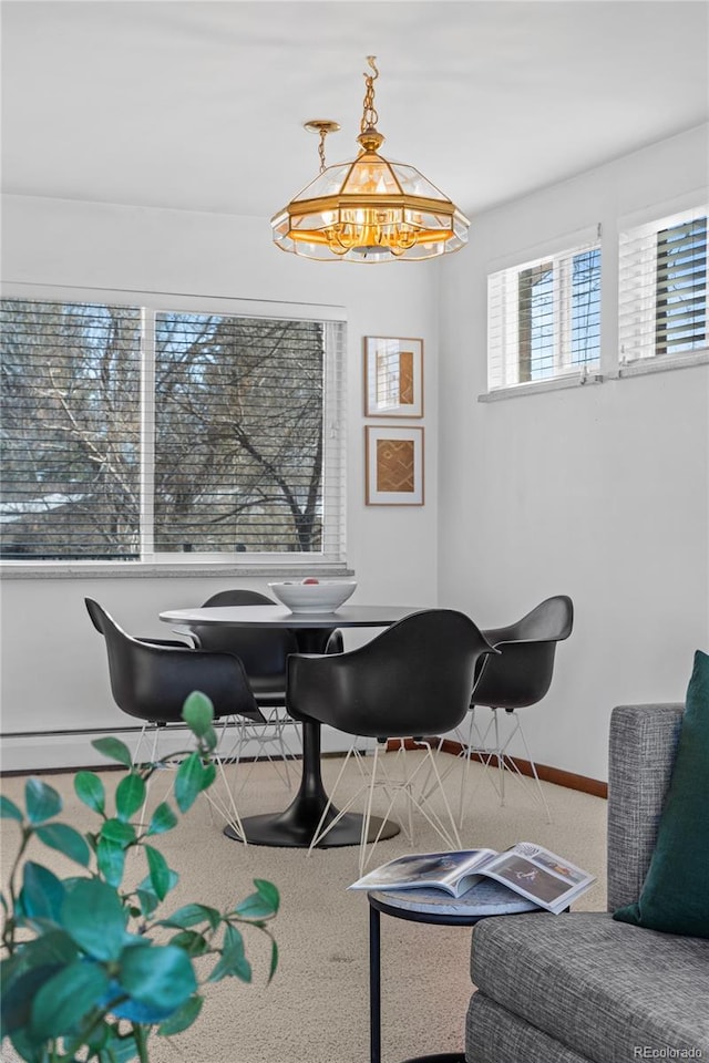 view of carpeted dining space