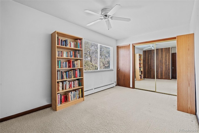 miscellaneous room featuring light colored carpet, ceiling fan, and baseboard heating