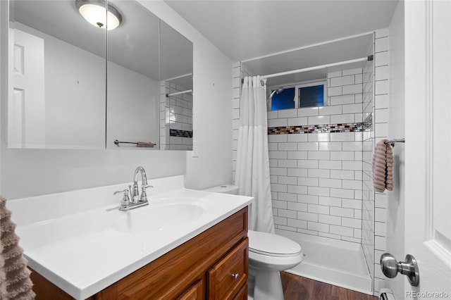 bathroom with vanity, wood-type flooring, toilet, and walk in shower