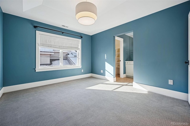 unfurnished bedroom with baseboards and carpet floors