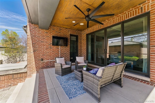 view of patio featuring an outdoor living space and a ceiling fan